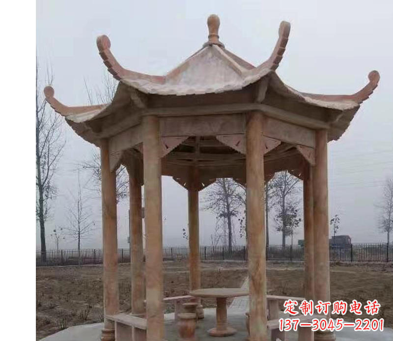 宜宾公园晚霞红八角石雕凉亭
